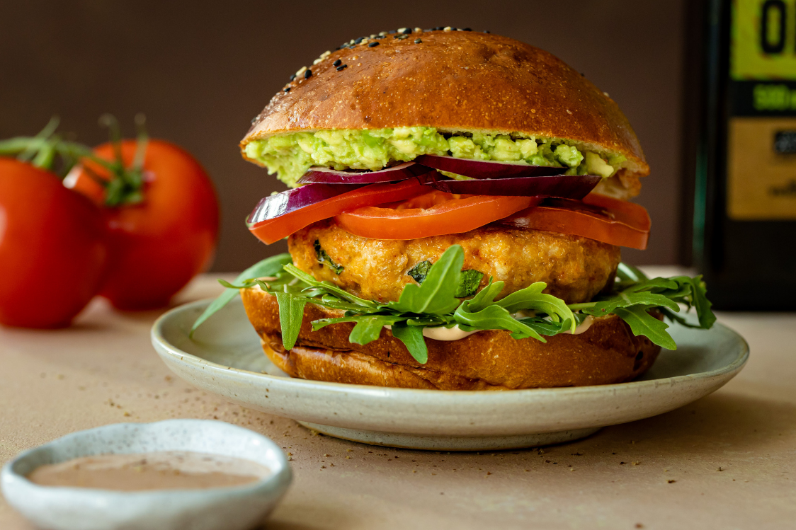 Juicy chicken burger with avocado and yoghurt dressing