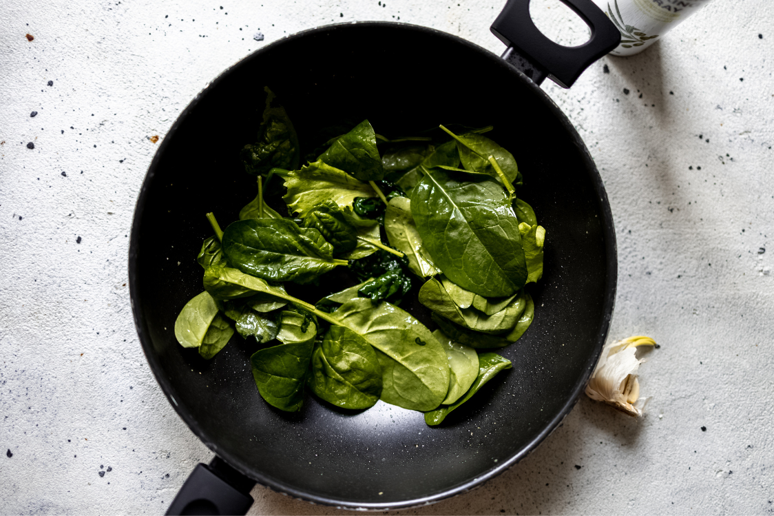 Savoury protein crêpes filled with spinach, salmon, and a sunny-side-up egg — spinach preparation