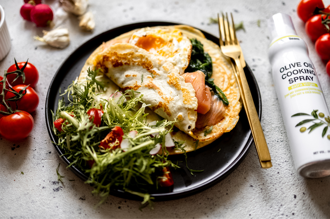 Savoury protein crêpes filled with spinach, salmon, and a sunny-side-up egg
